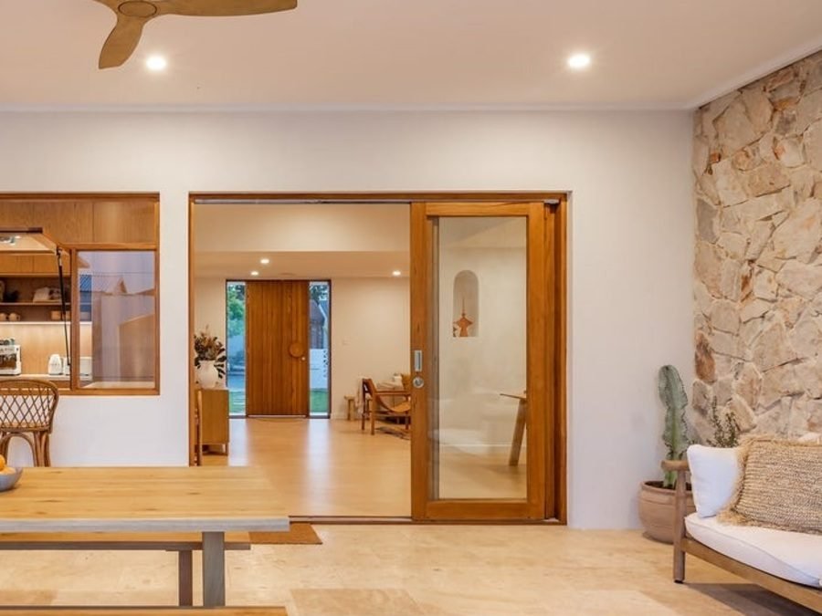 Timber-framed sliding door onto outdoor entertaining area