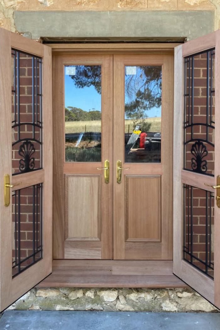 French entry doors with feature wrought iron side panels