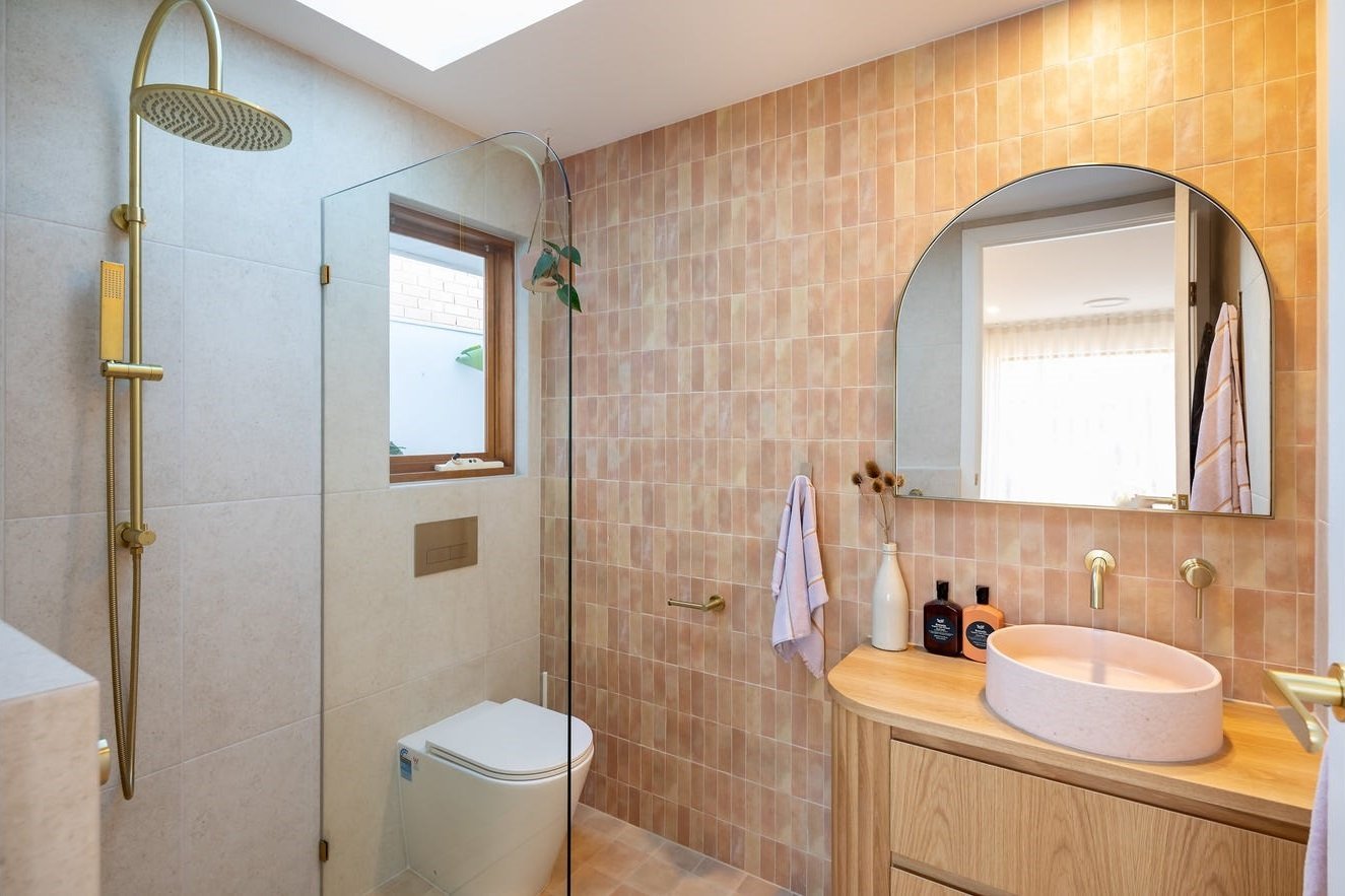 Small timber-framed awning window in an ensuite shower, bathroom renovation