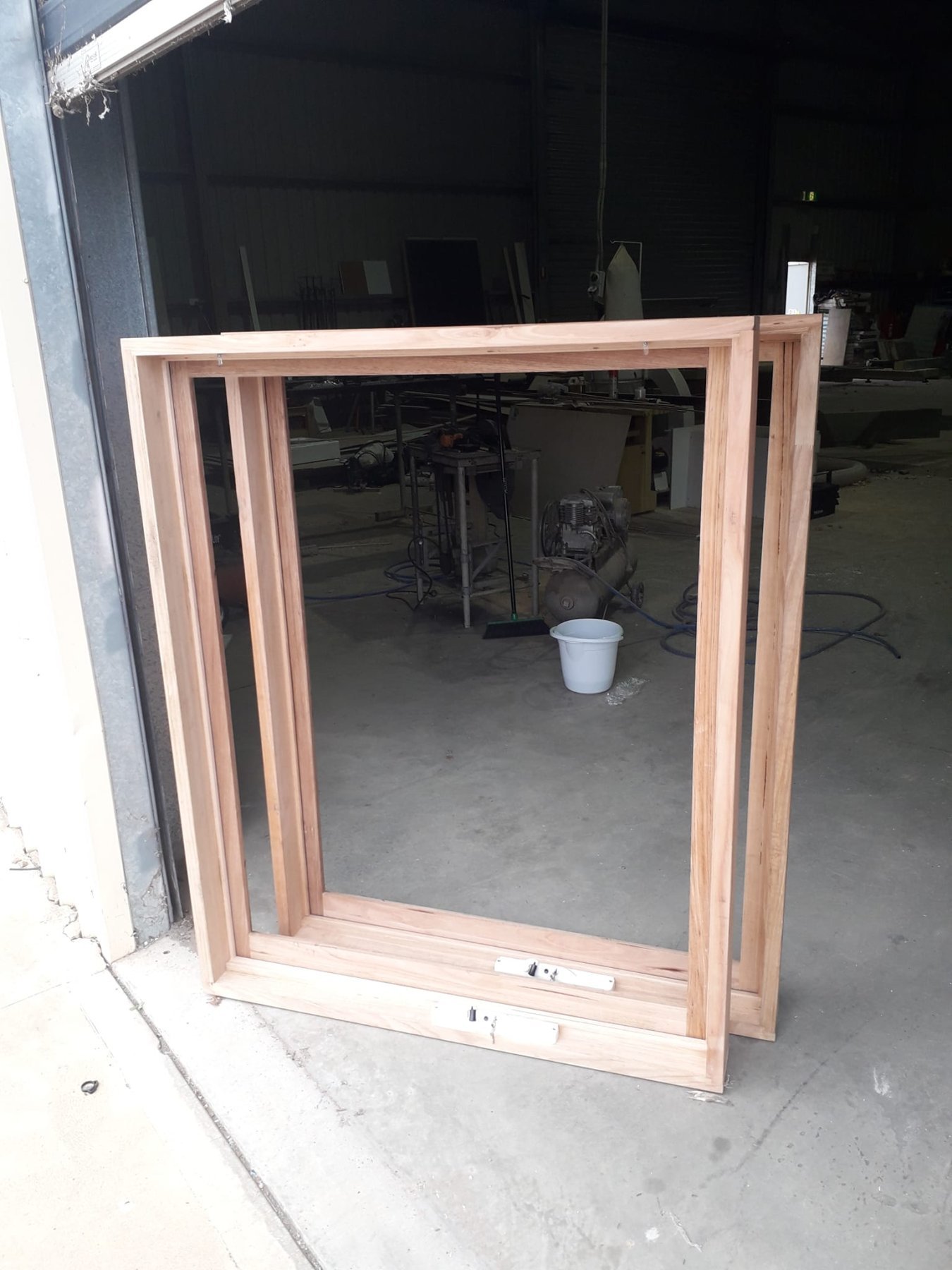 Vic Ash double awning window frame, unfinished, standing in the workshop