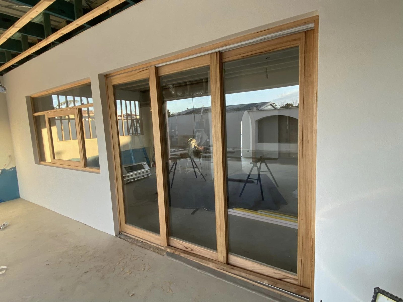 Vic Ash sliding door and awning window combination on a pool-side patio extension, alternate angle